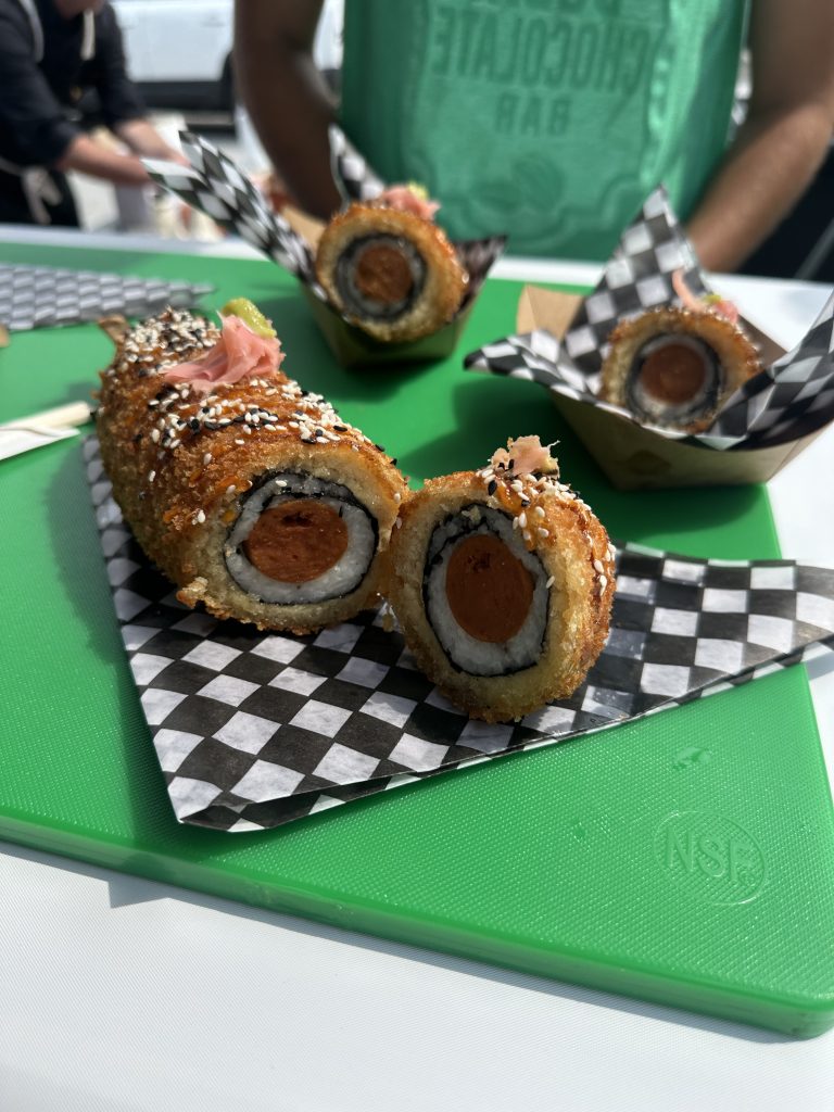 Sushi corndog: hotdog wrapped in sushi rice and seaweed, deep-fried in tempura.