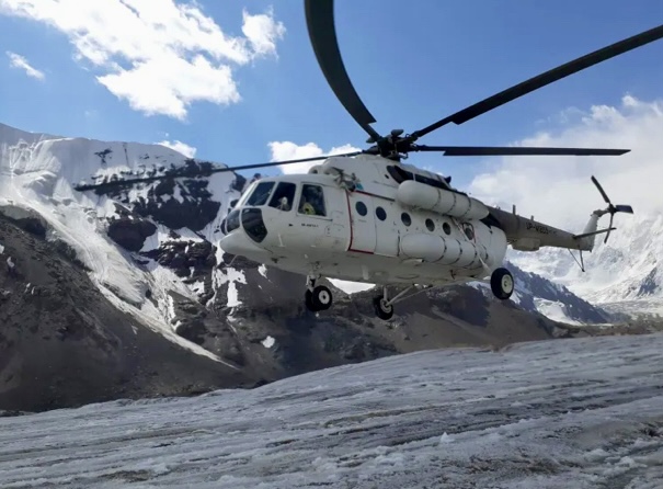 A helicopter arriving to Base Camp.