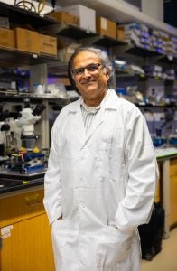 Mak Paranjape in a lab coat