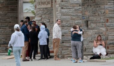 People who had been sheltering in place inside Villanova University’s St. Mary’s Hall gather outside after the all clear had been given by police. An earlier active shooter reported proved to have been a hoax.