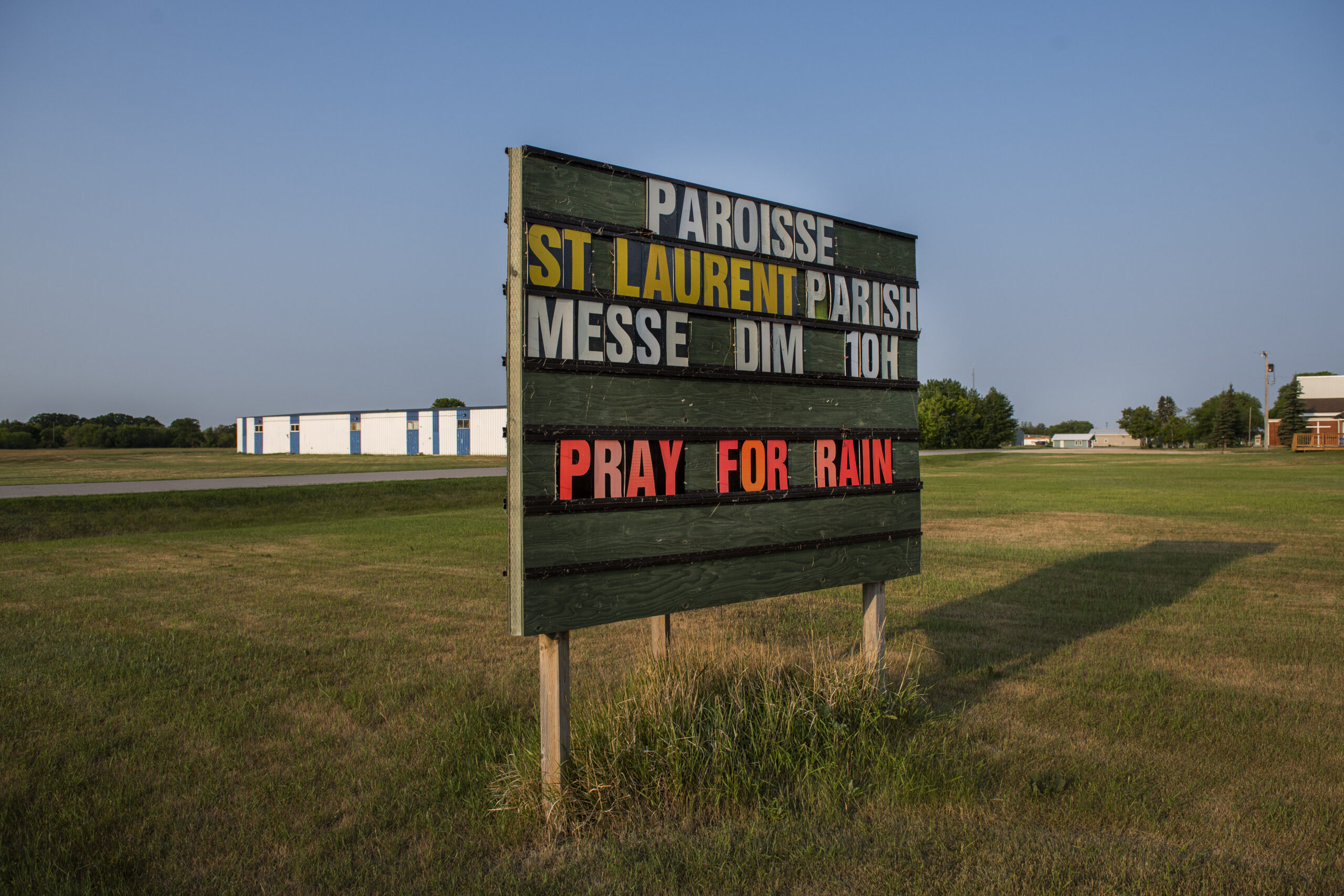 A sign in St. Laurent, Man., asking locals to pray for rain on Saturday, July 10, 2021. Photo: Aaron Vincent Elkaim / The Narwhal
