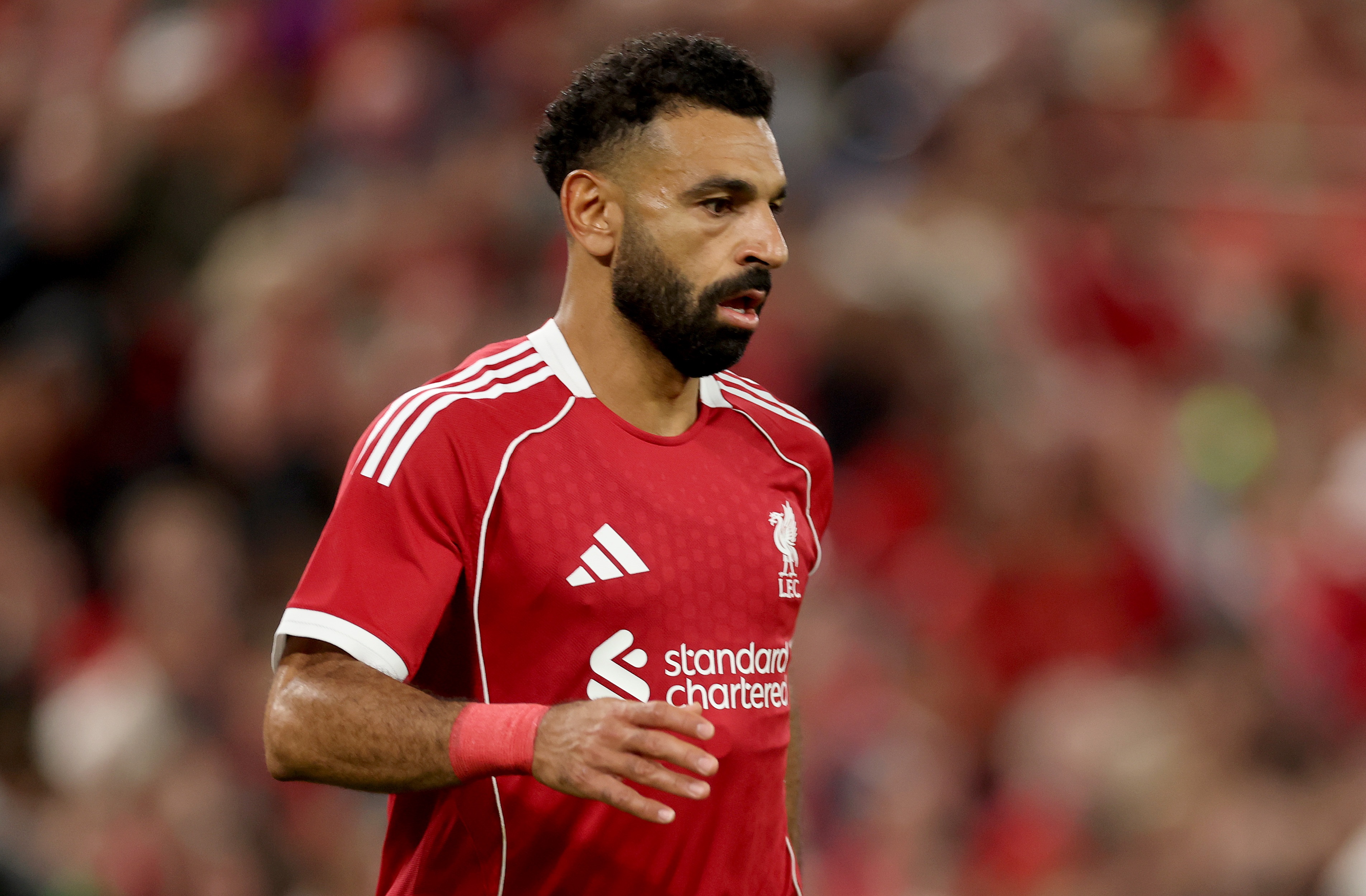 Mo Salah playing for Liverpool Football Club.