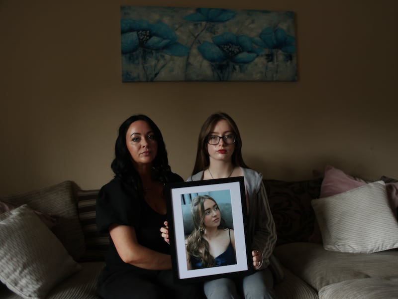 Suzi Mangan and her daughter Poppy Ferguson  hold a photo of Suzi’s older daughter Amelia Belle Ferguson, who died in June 2024. Photograph: Bryan O’Brien 
 
