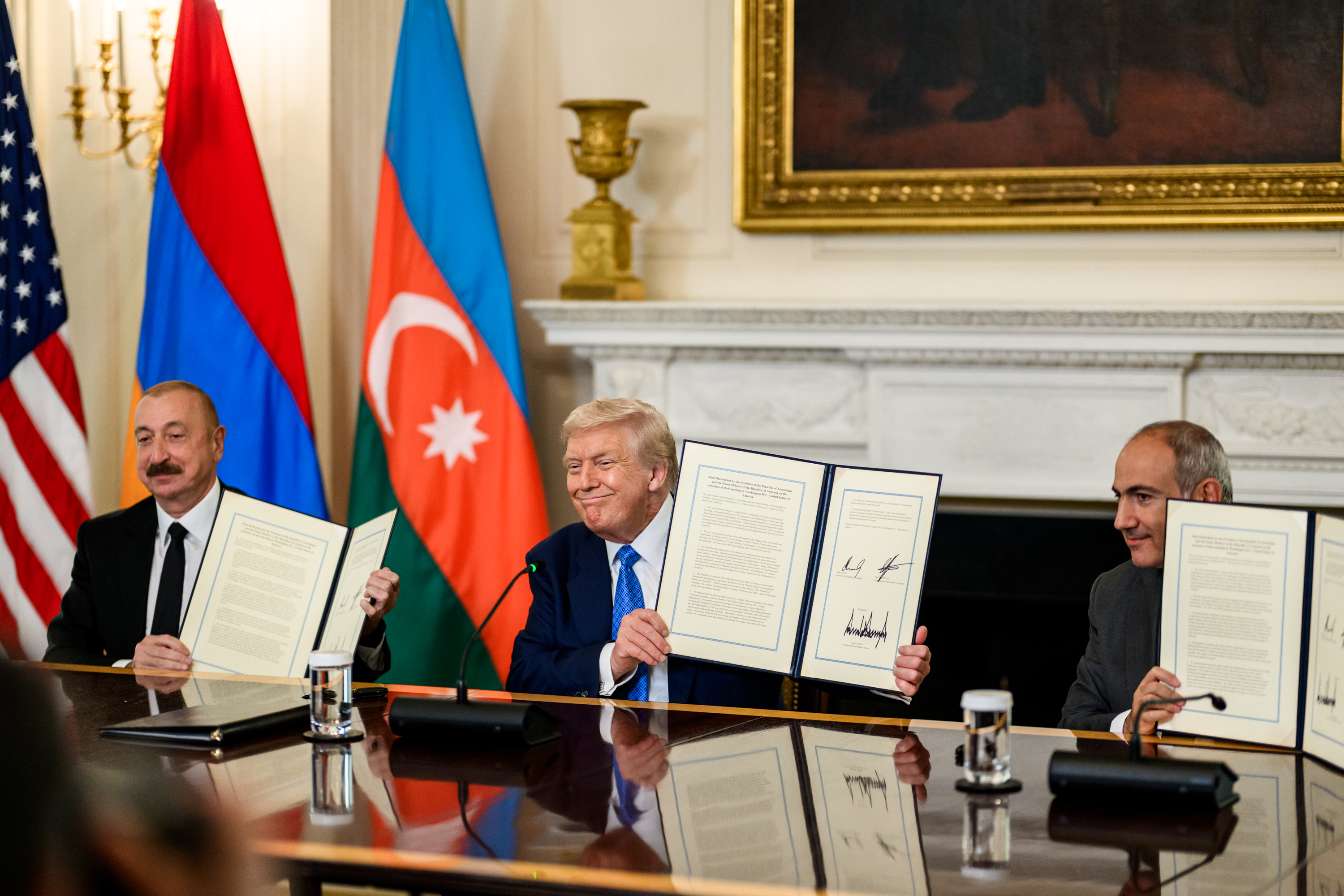 President Donald Trump signs a trilateral joint declaration with President Ilham Aliyev of Azerbaijan and Prime Minister Nikol Pashinyan of Armenia, Friday, August 8, 2025, in the State Dining Room. (Official White House Photo by Daniel Torok)