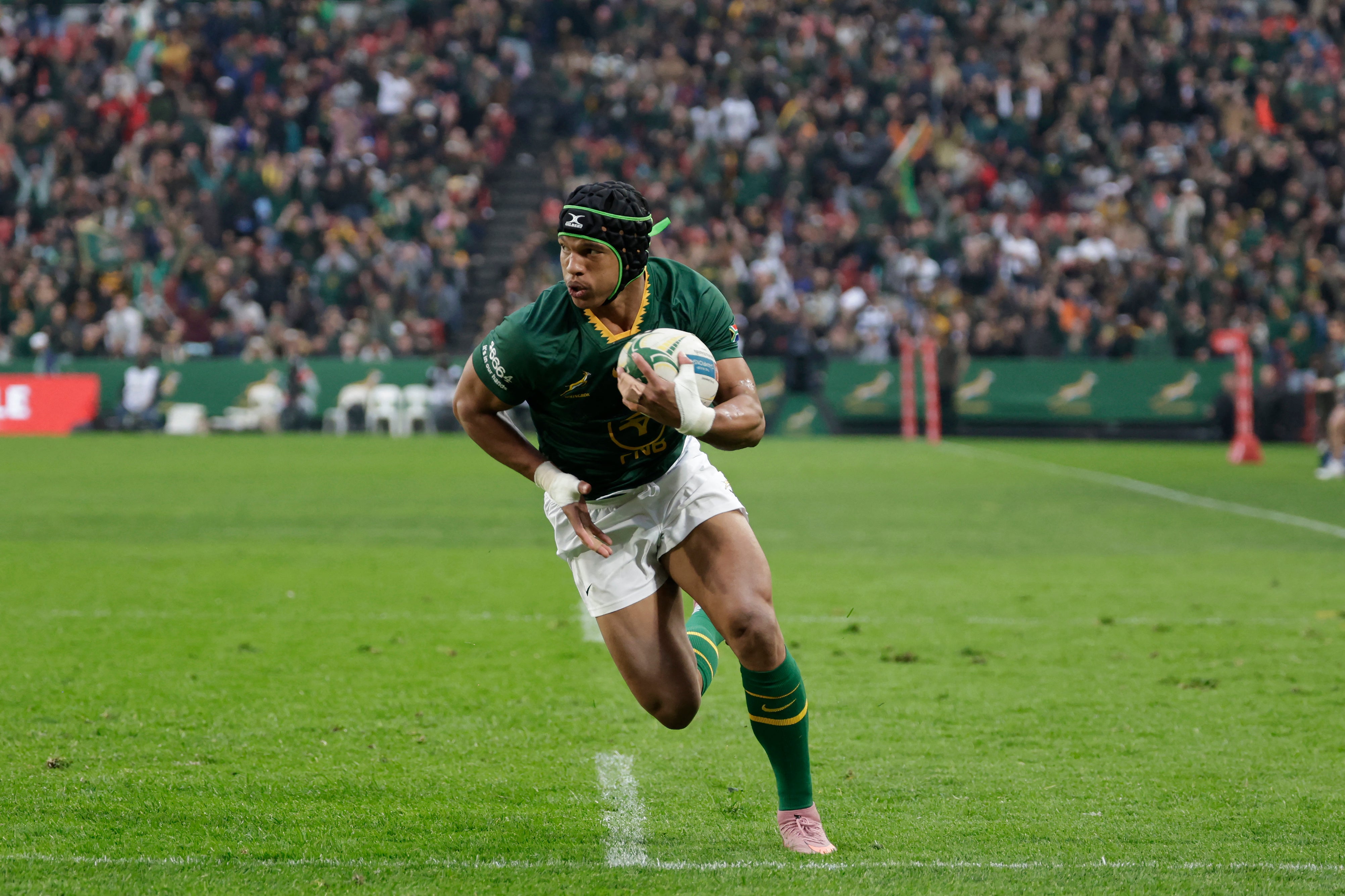 South Africa's Kurt-Lee Arendse runs to score a try