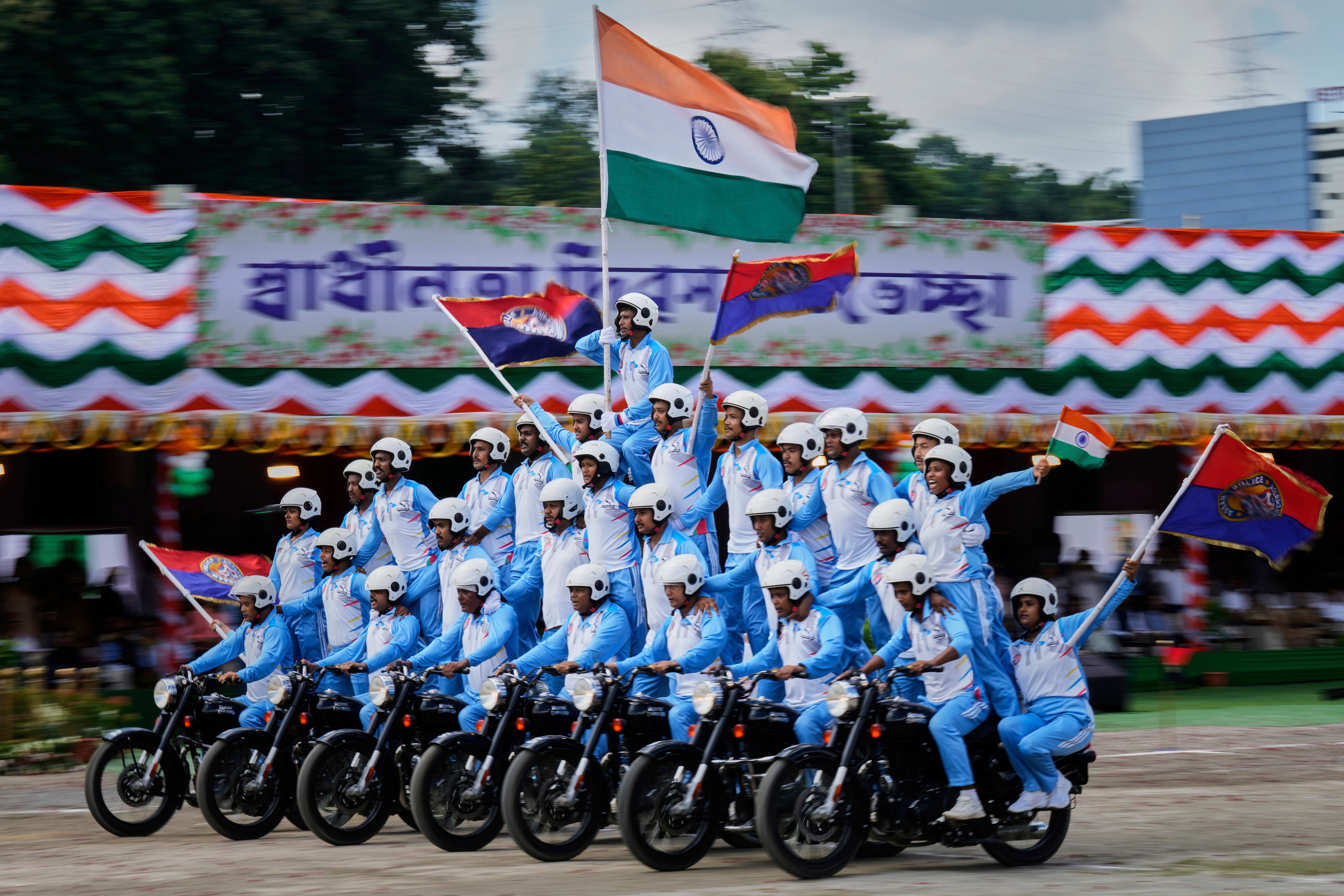 Assam Police commandos riders take part in a parade during the country's Independence Day celebrations in Guwahati, India