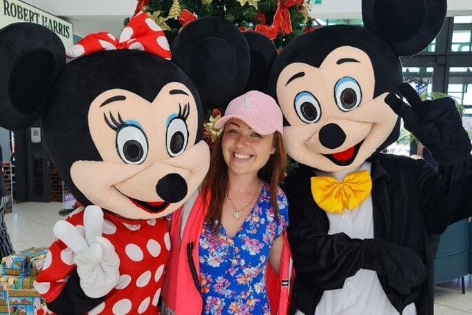  Julia Manktelow with Mickey and Minnie Mouse at a Pāpāmoa Christmas parade. Photo / Supplied.