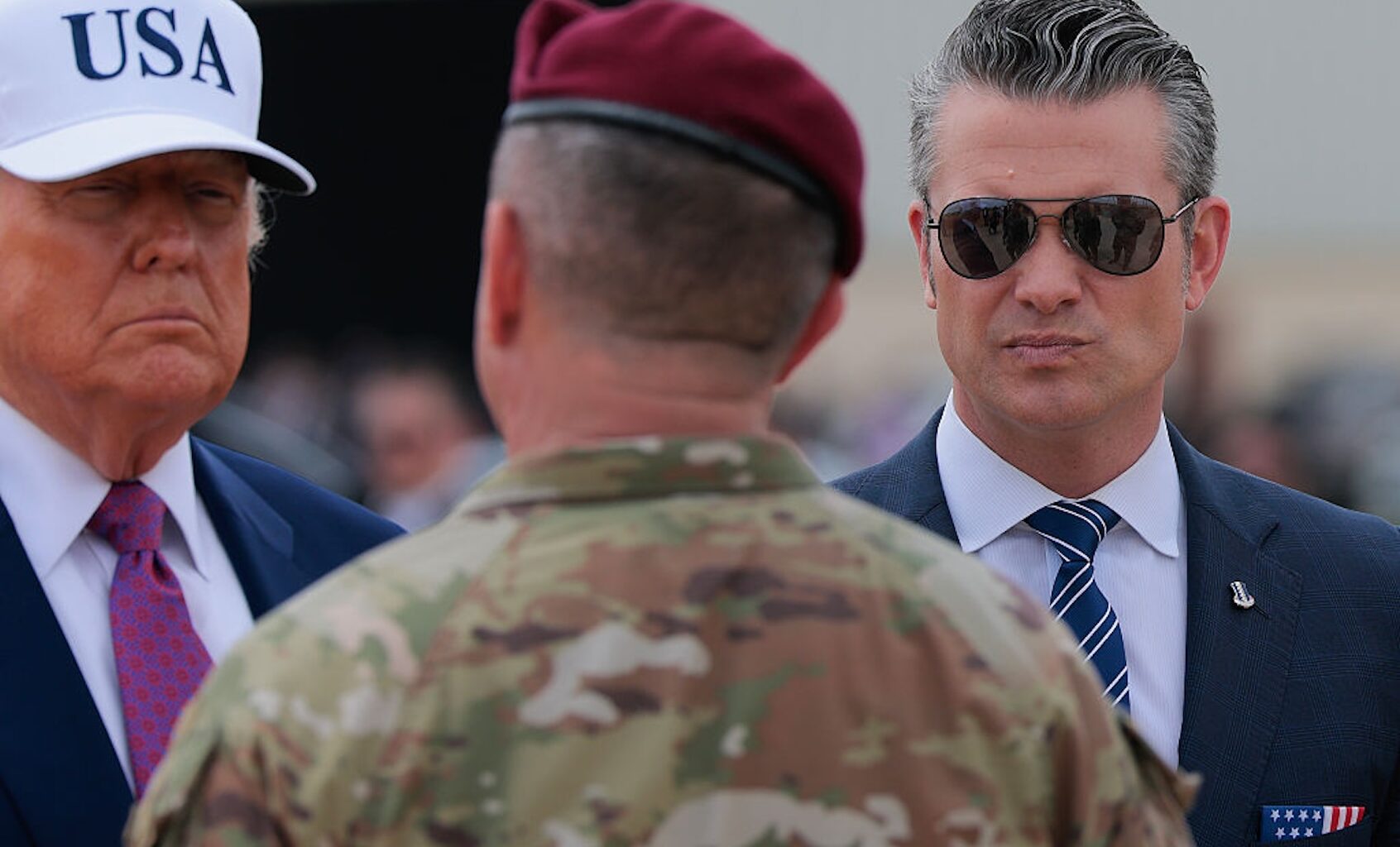 President Donald Trump and Secretary of Defense Pete Hegseth are greeted by 18th Airborne Corps Commander Lt. Gen. Gregory Anderson on June 10, 2025 at Fort Bragg, N.C. (Anna Moneymaker/Getty Images)