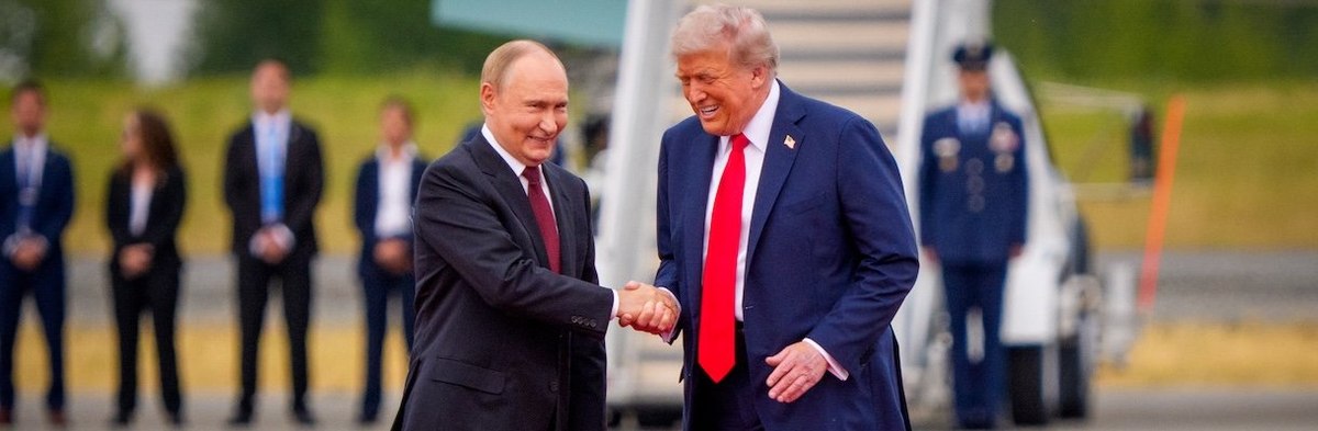 ANCHORAGE, ALASKA - AUGUST 15: U.S. President Donald Trump (R) greets Russian President Vladimir Putin as he arrives at Joint Base Elmendorf-Richardson on August 15, 2025 in Anchorage, Alaska. The two leaders are meeting for peace talks aimed at ending th