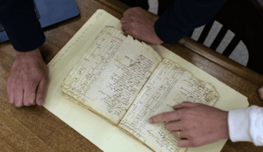 Gabriel Raeburn and Christine Bachman-Sanders reviews documents.