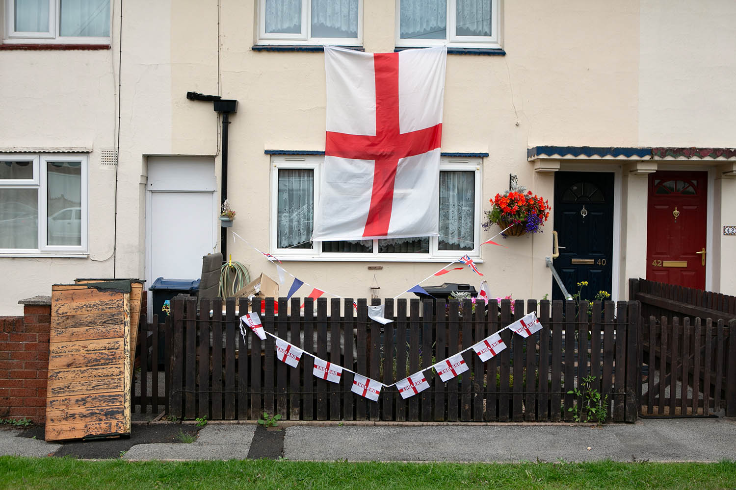 St George flags hang outside a home in Weoley Castle