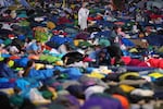 Young people wake up after spending the night at the Tor Vergata field in Rome as they participate in the Youths Jubilee, Sunday, Aug. 3, 2025.