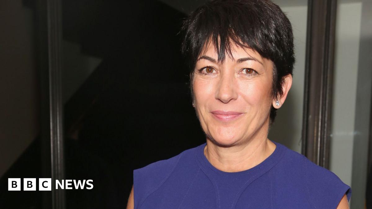 Ghislaine Maxwell smiles while wearing a blue dress