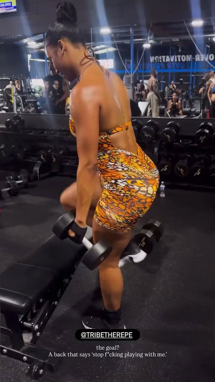 Kayla Nicole working out in gym, lifting dumbbells, sparking buzz after Travis Kelce proposal news.