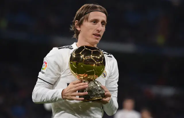 Luka Modric of Real Madrid presents his Balon d'Or Trophy
