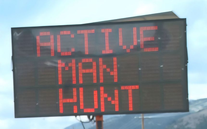 Electronic signs on Montana Highway 1 west of Anaconda warn drivers to stay alert due to the ongoing manhunt.