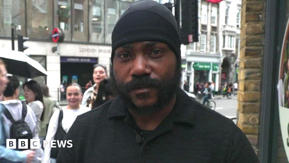 Shaun Thompson stands across the road from an entrance to London Bridge tube station