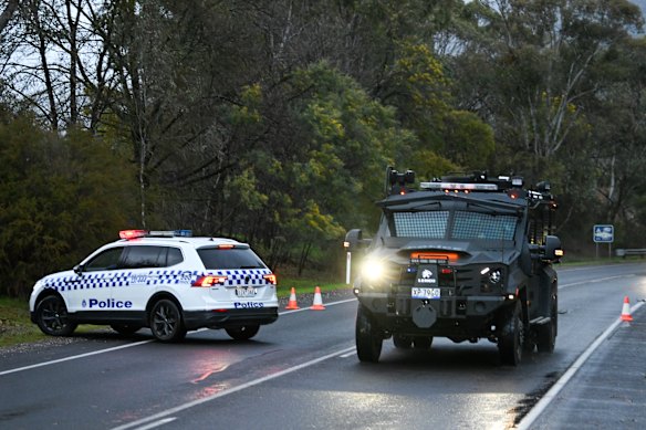 A Bearcat leaves the property where Freeman lived on Thursday night.