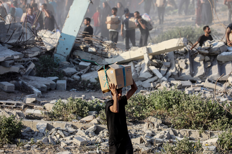 A man carries a box on his head