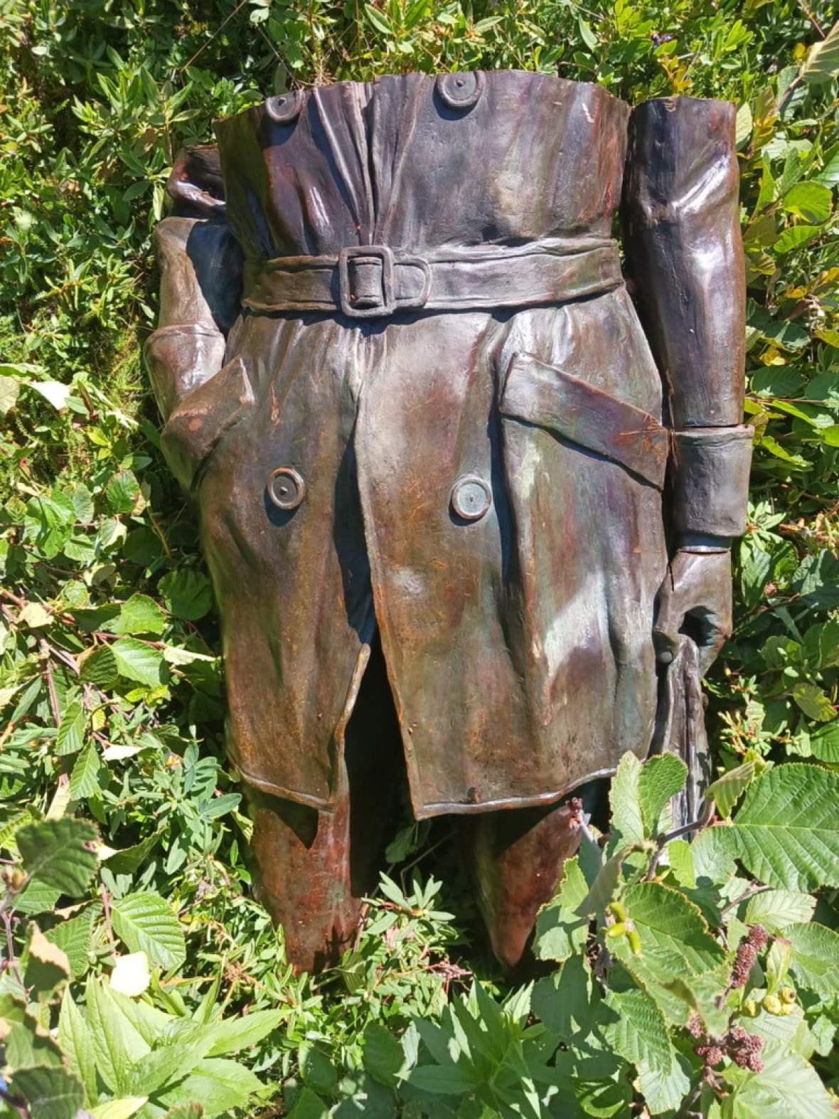 The torso from a bronze statue of a woman.