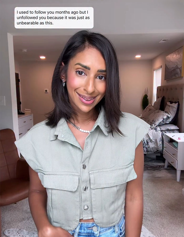 Woman smiling in a casual outfit, discussing feelings of jealousy related to Sweeney’s AE ad and its impact on her.