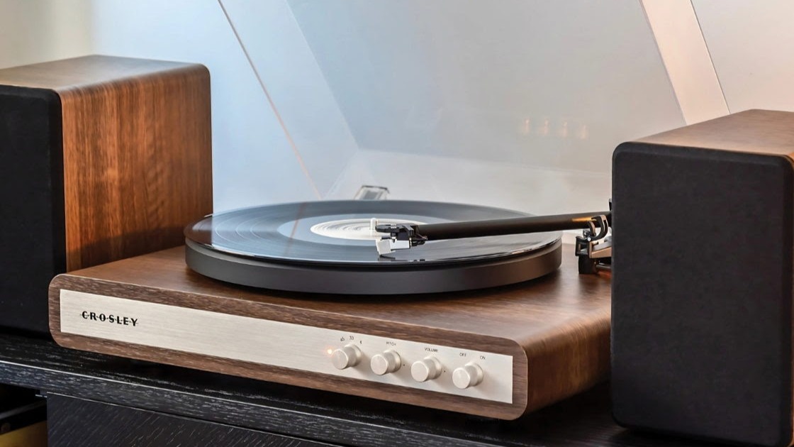 Crosley record player system with attached speakers