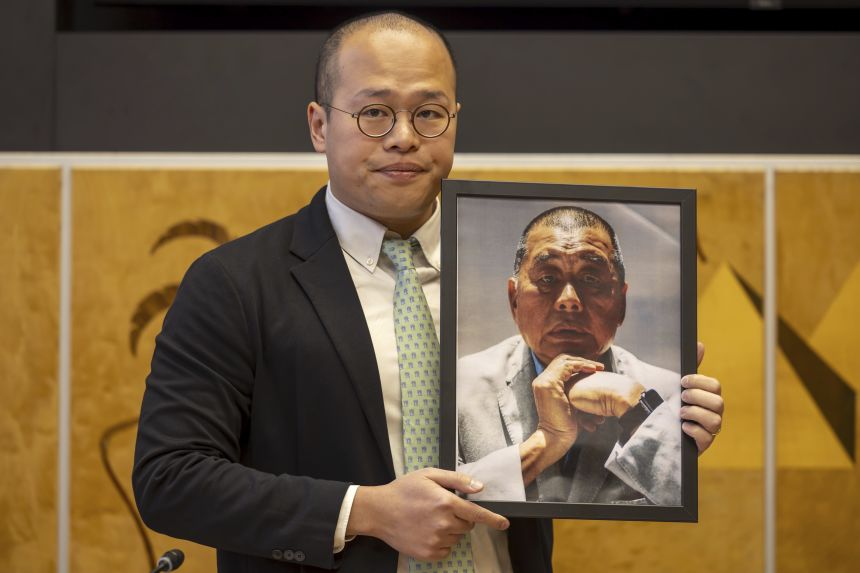 Sebastien Lai, son of imprisoned Hong Kong media publisher Jimmy Lai, shows a picture of his father, during a preview of the Geneva Summit for Human Rights, at the European headquarters of the United Nations in Geneva, Switzerland on February 17, 2025.