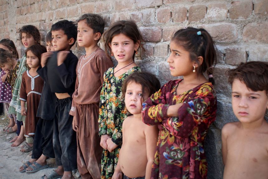 Afghan children wait in line to get a polio vaccine in Jalalabad, Afghanistan, in May.