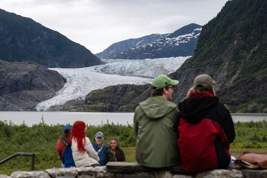 People view Mendenhall Glacier from the Mendenhall Glacier Visitors Center area, Sunday, Aug. 3, 2025, in Juneau, Alaska.