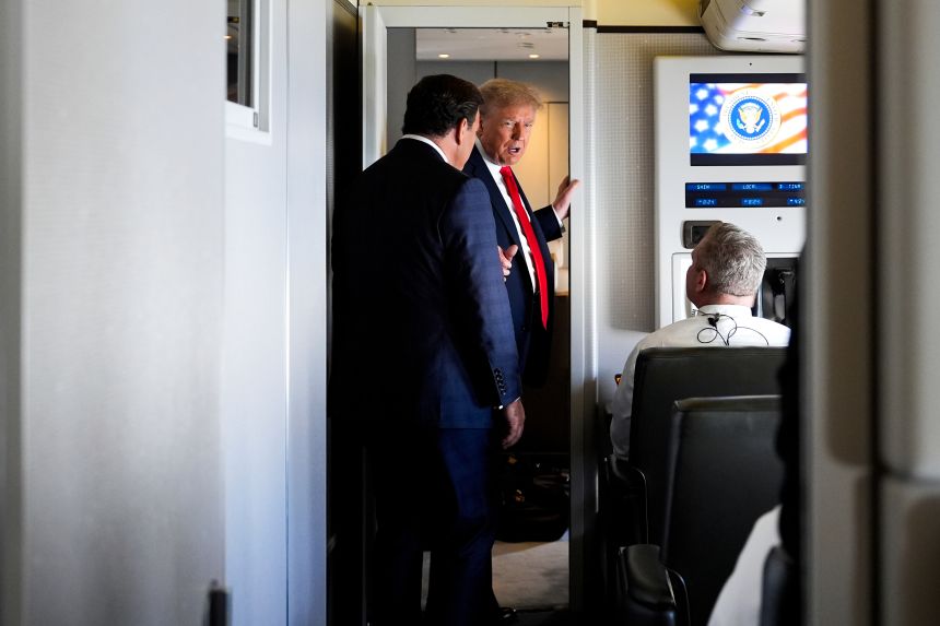 President Donald Trump after speaking with reporters aboard Air Force One while en route to Joint Base Elmendorf-Richardson, Alaska, on Friday, August 15, 2025.