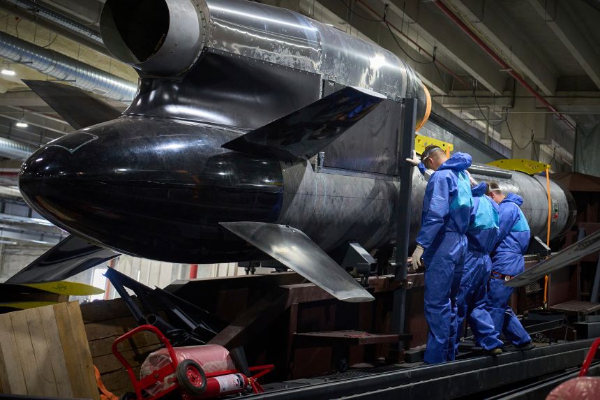 Workers inspect a Flamingo cruise missile at Fire Point's secret factory in Ukraine on August 18, 2025.