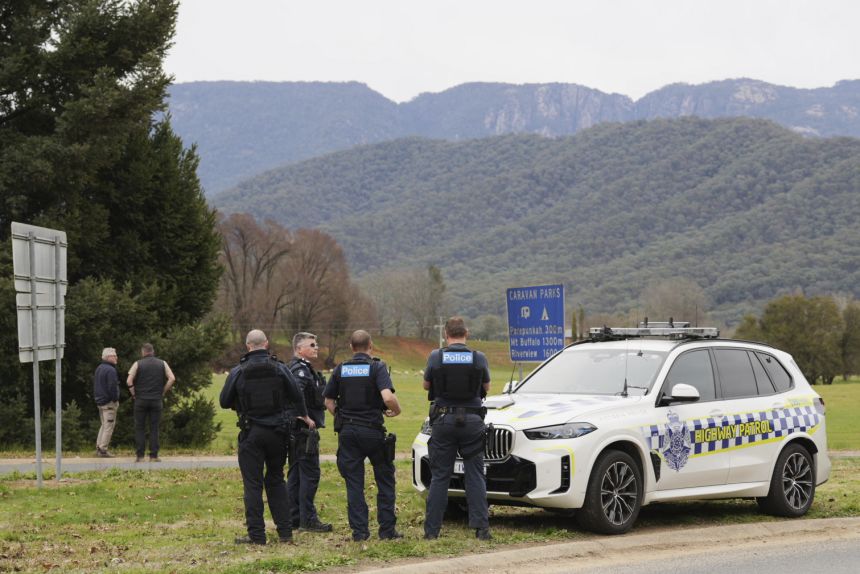 Police wait near the scene of a shooting in the high country of Porepunkah in the state of Victoria, Australia, Tuesday, Aug. 26, 2025.