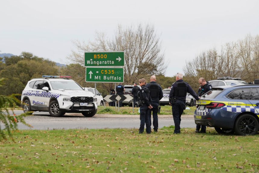 Police wait near the scene of a shooting in the high country of Porepunkah in the state of Victoria, Australia, Tuesday, Aug. 26, 2025.