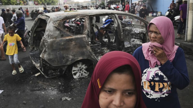 Three dead as Indonesian protesters set fire to regional parliament building