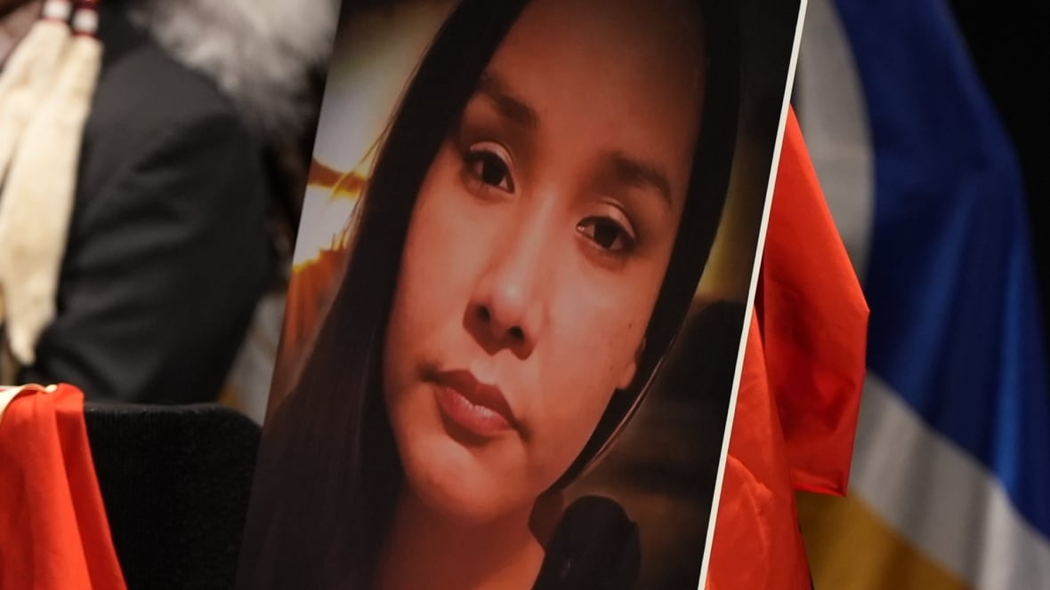 A closeup of a photo of a young woman.