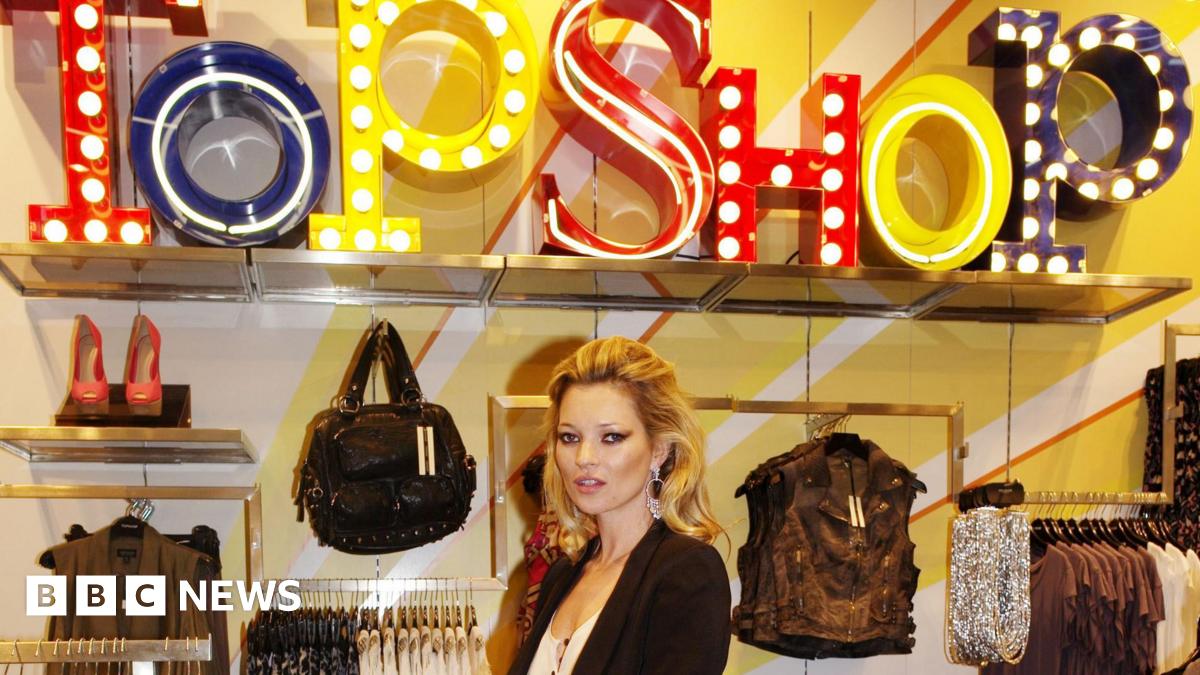 Yavar Abbas, 104, with glasses and Panama hat saluting