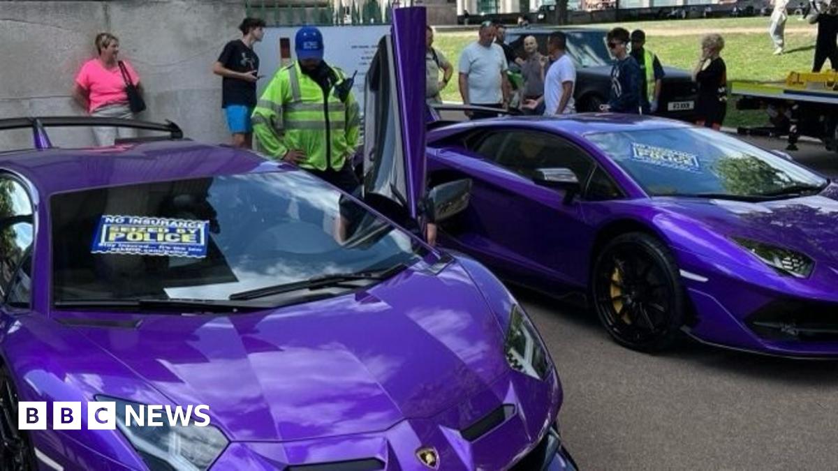 Two purple Lamborghinis, each with a sign that reads: "Seized by Police" on the windscreen