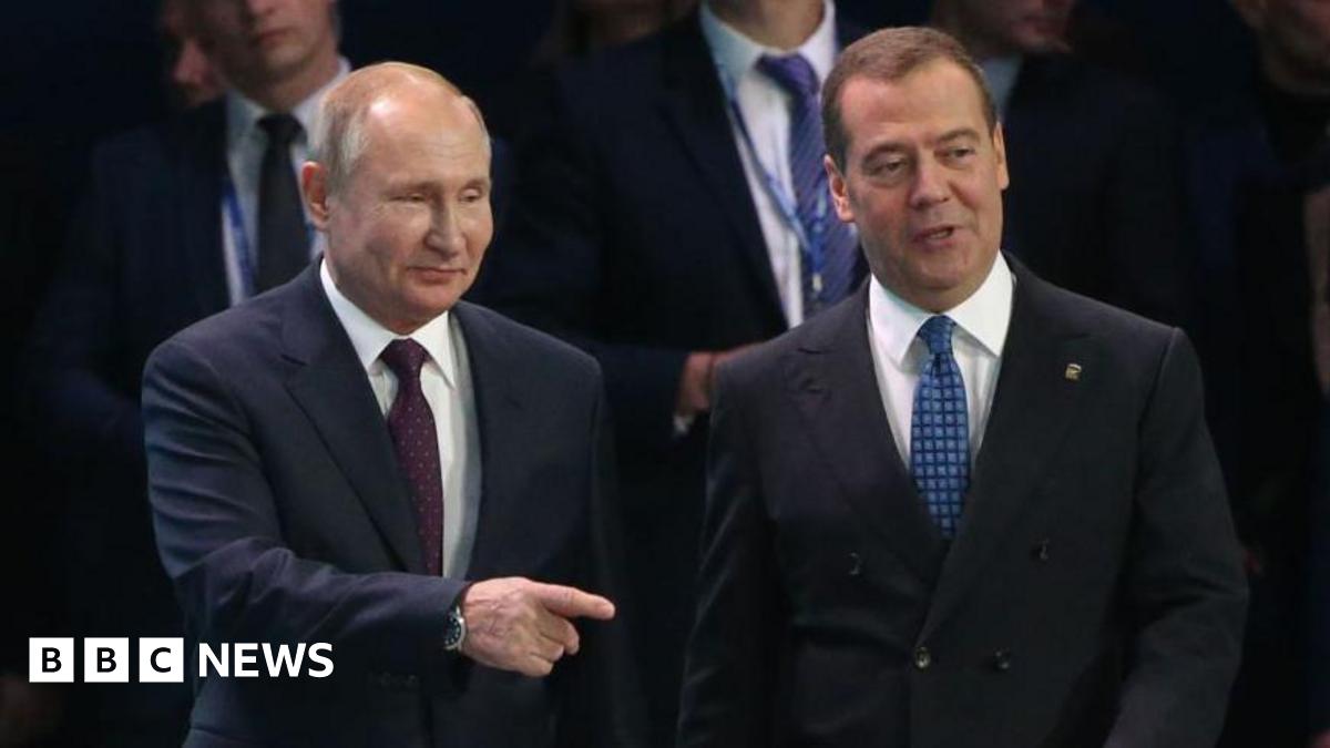 Russian President Vladimir Putin (L) and Prime Minister Dmitry Medvedev (R) enter the hall during the XIX Congress of United Russia Party on November 23, 2019 in Moscow, Russia.
