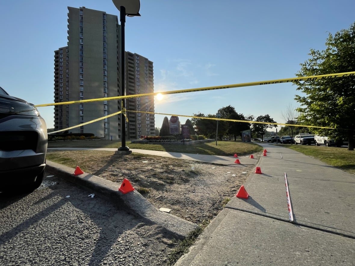An apartment building with police tape around in 