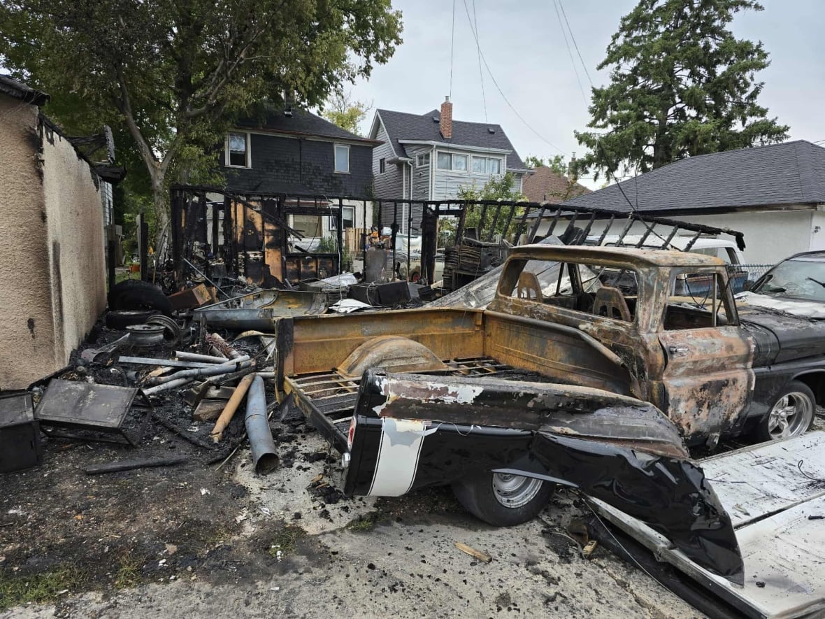 A burnt out truck and other burnt objects