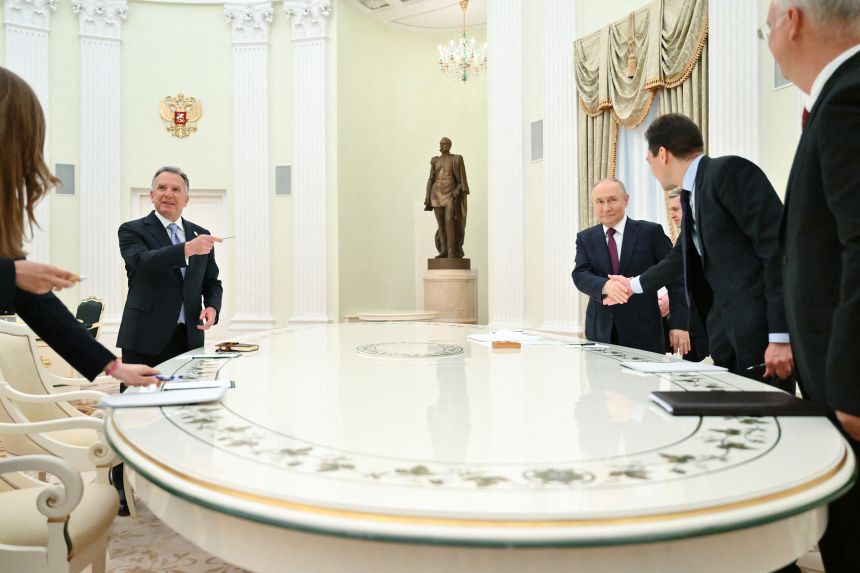 In this pool photograph distributed by Russian state agency Sputnik, Russia's President Vladimir Putin and US Special Envoy Steve Witkoff arrive for their talks in Moscow on April 25.