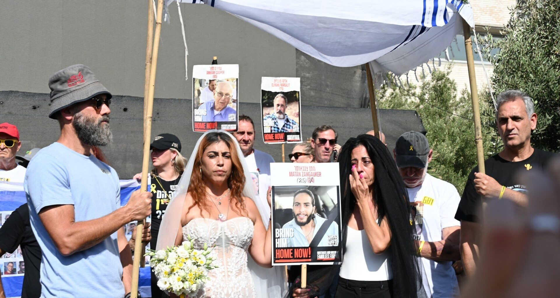 Families stage mock wedding for hostage Matan Zangauker and ex-captive partner
