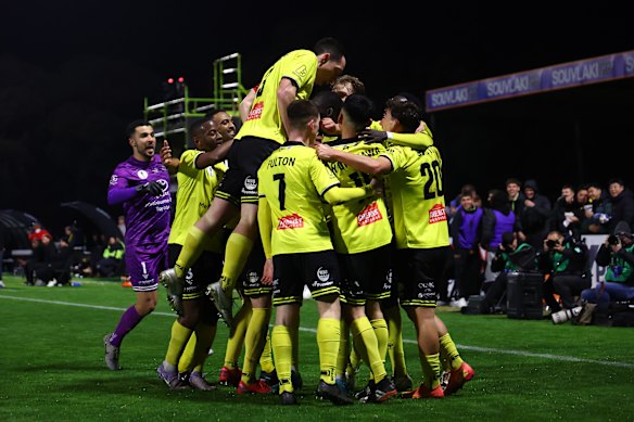 Heidelberg United FC celebrate a goal against Wellington on Tuesday night.