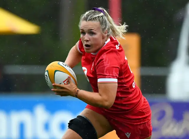 Alex Callender charges at the Australia defence with the ball in hand for Wales
