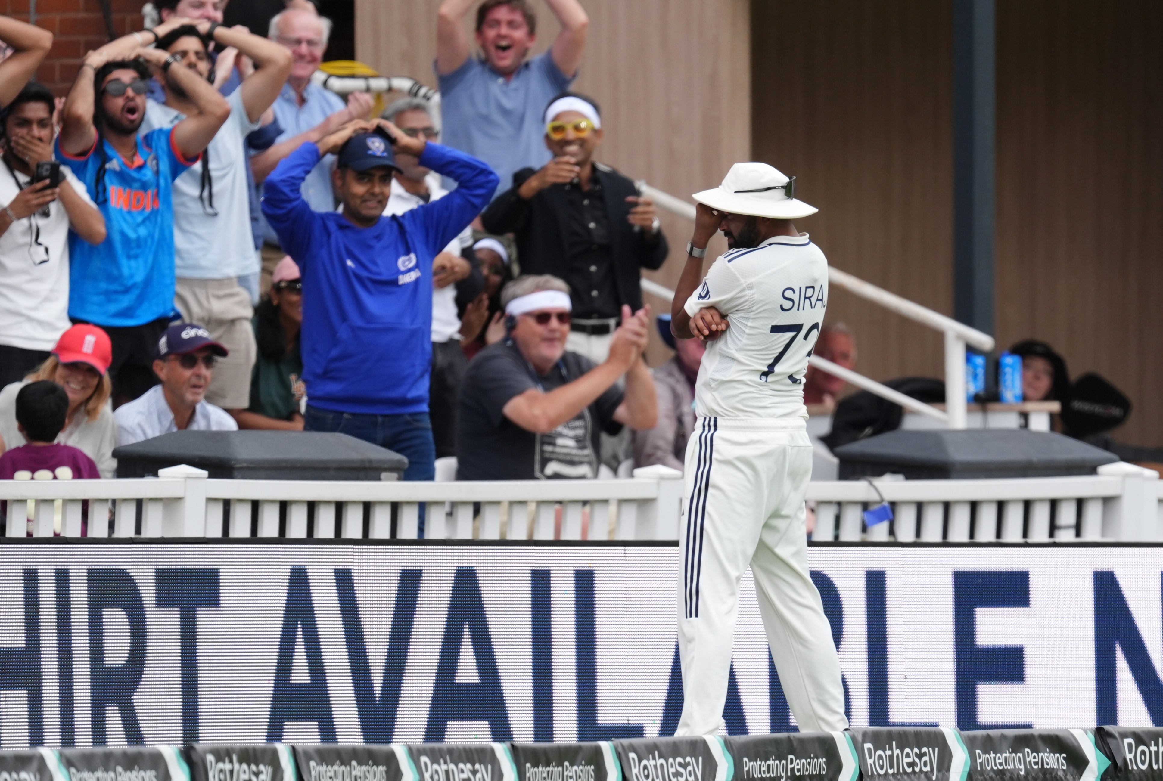 Siraj and the crowd can’t quite believe his boundary blunder