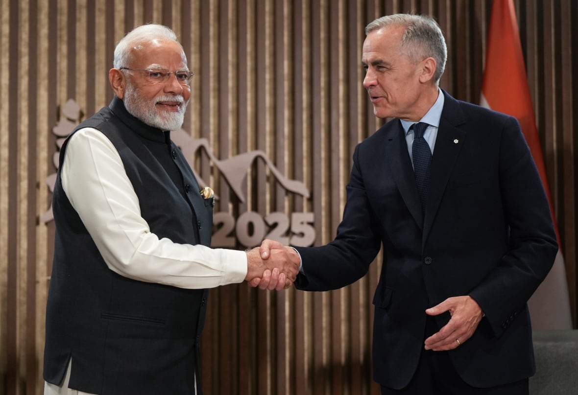 Indian Prime Minister Narendra Modi, left, and Canadian Prime Minister Mark Carney shake hands during a meeting at the G7 Summit in Kananaskis, Alta., on Tuesday, June 17, 2025.