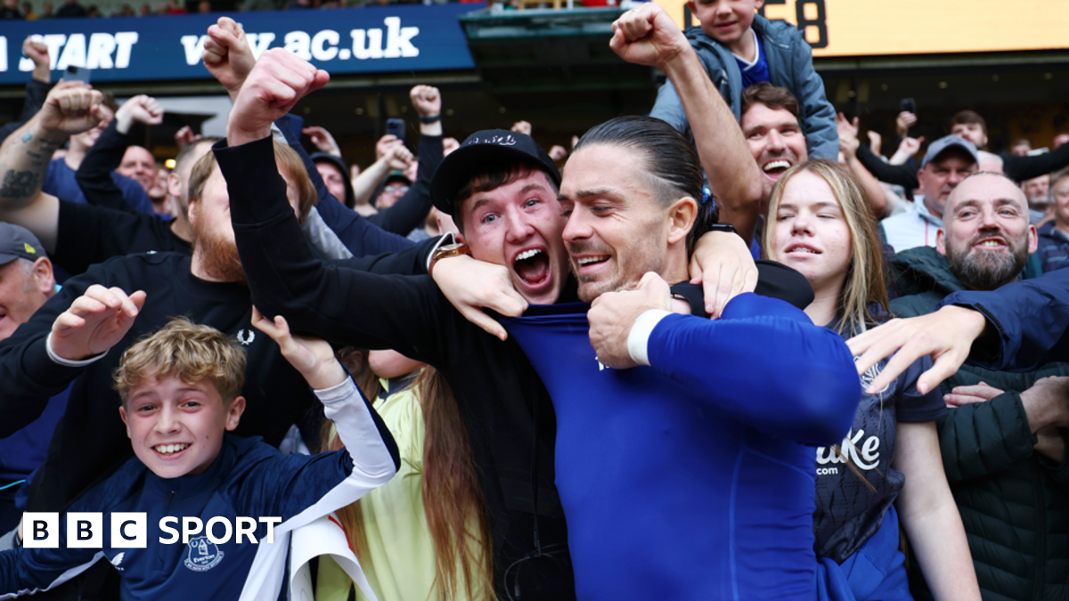 Jack Grealish is mobbed by fans after Everton's win at Wolves