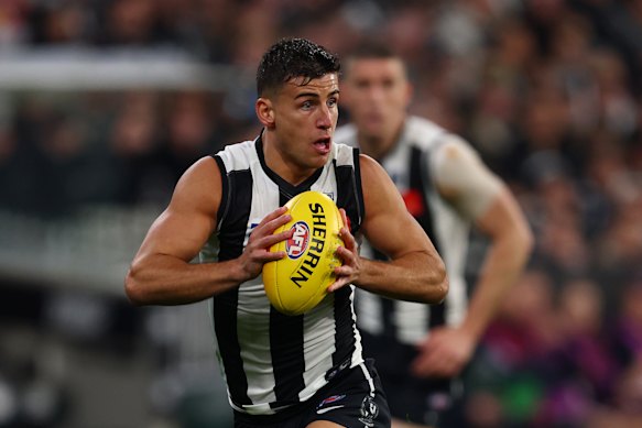 Nick Daicos of the Magpies was a surprise starter on the bench against Hawthorn.