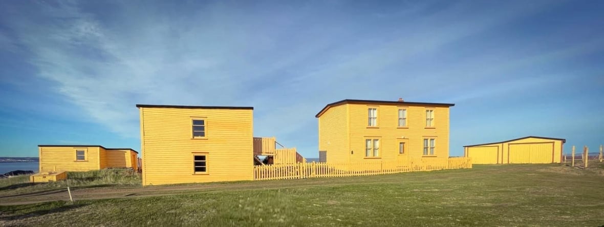 Several wooden structures painted yellow.