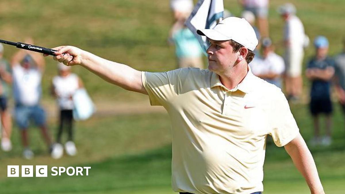 Robert MacIntyre holding his club